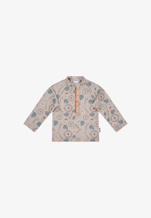 Beiges Kinderlangarmshirt mit Frontreißverschluss, verziert mit verspielten Löwengesichtern, Giraffen und einem Muster aus grünen Blättern.