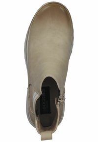 Beige leather ankle boot with elastic side panels, rounded toe, and white rubber sole. Features a heel pull tab for easy wear.