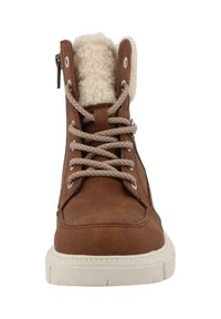 Brune faux læderstøvle med en fluffy beige foring, beige snørebånd, metaløjer og en hvid gummisål. Har en sidedragt for nem påføring.