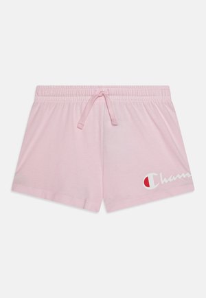 Shorts décontractés rose clair avec taille élastique et cordon de serrage, avec un logo blanc et rouge partiellement visible sur la jambe droite.