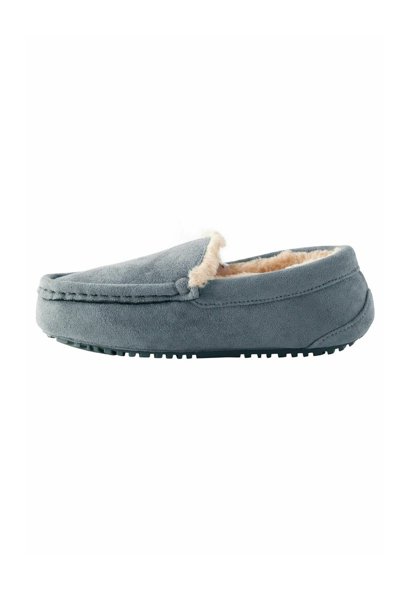 Gray suede slipper with a soft tan faux fur lining, flat sole, and stitched detailing along the edge, designed for comfort and warmth.