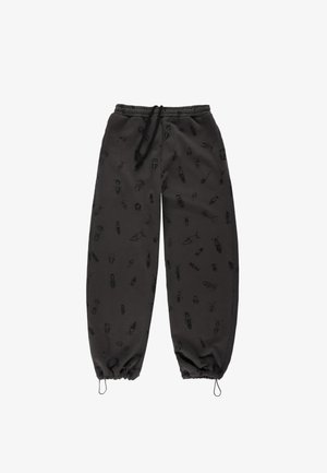 Czarne spodnie dresowe z ściągaczem w pasie i elastycznymi mankietami, ozdobione delikatnym wzorem owadów na całej powierzchni. Miękka, fakturowana tkanina.