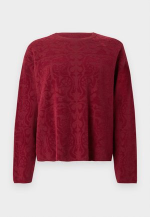 Maglione con maniche lunghe di colore rosso, caratterizzato da un motivo a trama. Scollo rotondo e vestibilità rilassata. Tessuto morbido a maglia.