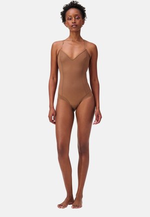 Brown one-piece swimsuit with thin straps, a v-neck design, and smooth, stretchy fabric. No patterns or embellishments.