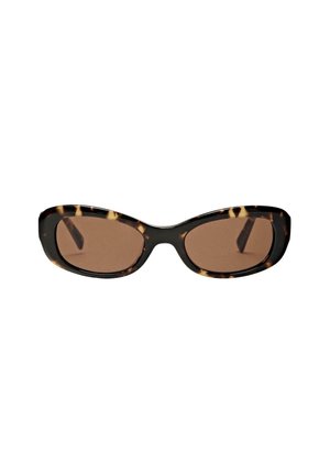 Tortoiseshell patterned sunglasses with large, rounded frames and brown lenses. The arms are sleek and slightly elongated.