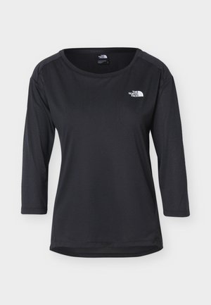 Μαύρο μακρυμάνικο μπλουζάκι με στρογγυλή λαιμόκοψη και το λογότυπο The North Face στο αριστερό μέρος του στήθους, απεικονισμένο σε απλό λευκό φόντο.