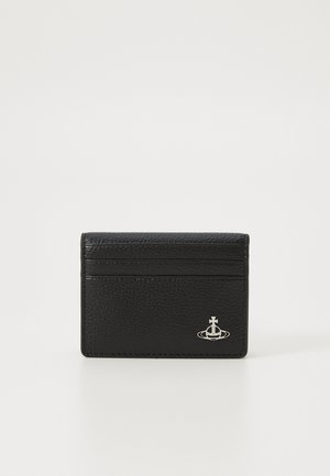 Black leather cardholder with textured surface, four card slots, and a silver emblem logo at the bottom center. Compact rectangular shape.