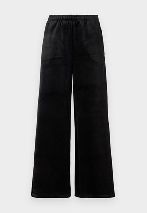 Pantalons larges noirs en tissu doux, avec une taille élastique et une texture lisse. Design simple sans motifs ni accents.
