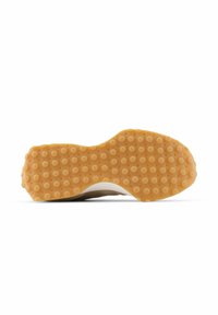 Semelle de chaussure avec un design en caoutchouc texturé de couleur marron et blanche, avec un motif à points pour la adhérence et la traction.