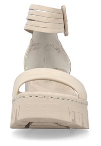 Beige platform sandal with a wide strap and multiple narrow ankle straps. Made of smooth material, featuring a textured sole and square toe.