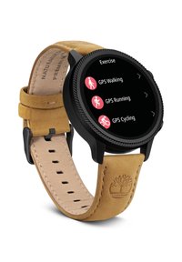 Smart watch s čiernym kovovým puzdrom, okrúhlym dotykovým displejom a koženým náramkom v tan farbe so vzorom. Displej zobrazuje možnosti cvičenia: GPS chôdza, beh, cyklistika.