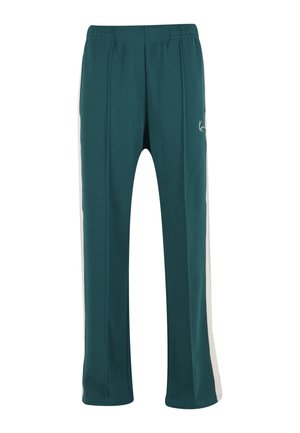 Pantalon de survêtement droit couleur sarcelle avec bandes blanches sur les côtés, ceinture élastique et petit logo blanc sur la partie supérieure de la cuisse gauche.