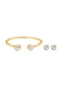 Anello placcato in oro con due pietre di zirconia cubica trasparenti e orecchini a bottone coordinati. Finitura liscia, design minimalista e forme circolari.