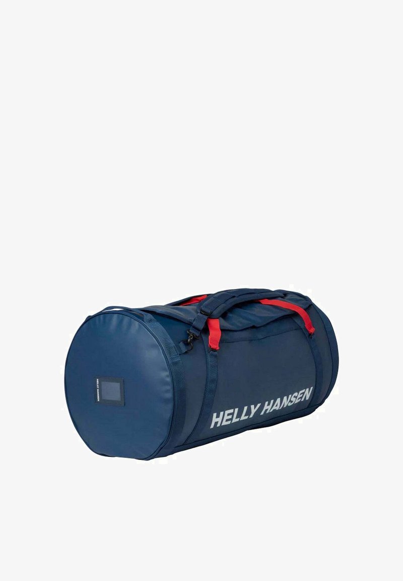 Granatowa cylindryczna torba sportowa z czerwonymi akcentami, wykonana z gładkiego materiału, z boczną metką i solidnymi podwójnymi uchwytami.