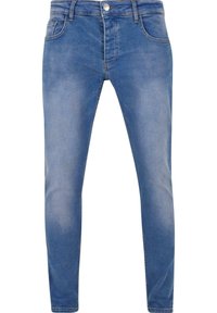 Plave traperice u slim fit kroju, s dizajnom od pet džepova i suptilnim izbljeđenjem. Imaju metalnu kopču i petlje za pojas.