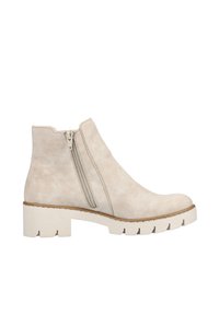 Bottines en suede beige avec une texture lisse, des zips sur les côtés et une semelle plateforme blanche robuste. Design simple avec un bout arrondi.