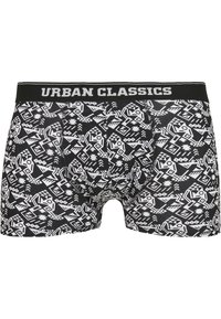 Schwarze Boxerbriefs mit enganliegendem Design, ausgestattet mit einem weißen geometrischen Muster und einem elastischen Bund, der mit „URBAN CLASSICS“ beschriftet ist.