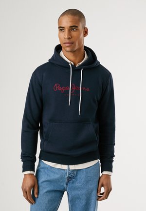 Mornarico modra kapuca s prednjim žepom, ki ima bele vrvice in rdeč logotip "Pepe Jeans London" na prsih. Iz bombažnega materiala.