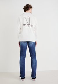 Replay ANBASS PANTS - Jeans slim fit - medium blue