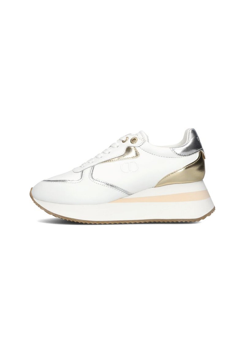 White sneaker with metallic silver accents and gold-colored details. Features a textured sole and a thick heel for added height. Laced design.