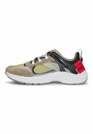 Sport shoes featuring a mix of olive green mesh and tan suede, black accents, elastic laces, and white rubber sole with red branding.
