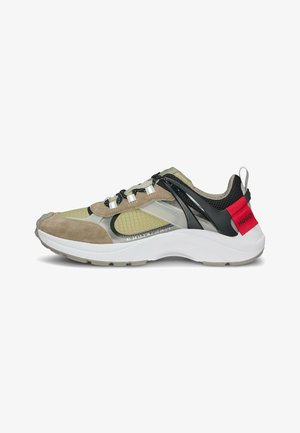 Sport shoes featuring a mix of olive green mesh and tan suede, black accents, elastic laces, and white rubber sole with red branding.
