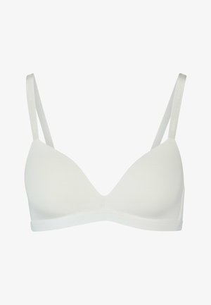 Balts, pūkains krūšturis ar trīsstūra formām, regulējamiem siksniņām un bezšuvju dizainu. Mīksta tekstūra ar gludu apdari; nav redzamu detaļu.