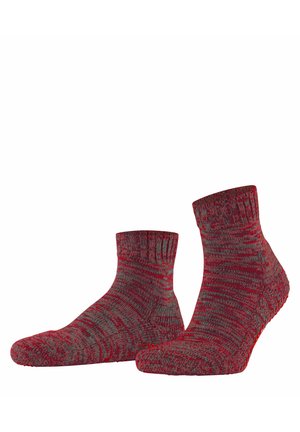 Pair of mid-calf red and gray knit socks with a textured pattern and non-slip soles, shown against a white background.