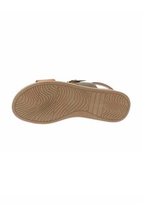 Sole di sandalo con un motivo ondulato testurizzato, realizzata in gomma marrone chiaro. Presenta un leggero arco e bordi arrotondati per il comfort.