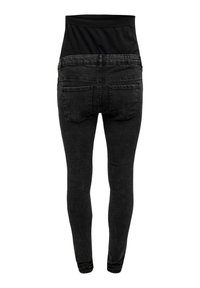 Black stretchy jeans with high waist, fitted silhouette, two back pockets, and smooth texture. Fabric appears slightly faded.