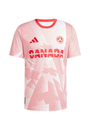 Crvena i bijela majica kratkih rukava s natpisom "KANADA" u podebljanim crvenim slovima, nalazi se točkastim uzorkom i Adidas logom na lijevom ramenu.