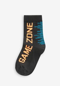 Sorte bomuldsstrømper med "GAME ZONE" i orange og grafiske lydvave-mønstre i blå. Har ribbet manchet for en sikker pasform.