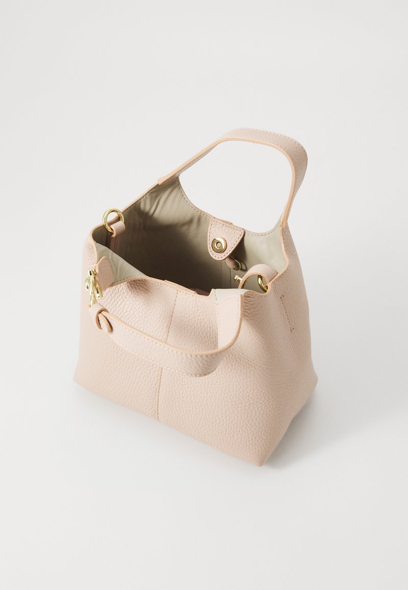 Pink pebbled leather tote bag with a smooth interior, top handles, and gold-tone hardware. Open top with a button closure detail.