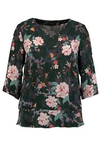 Blommig blus i mörkgrön tyg, med v-ringning, trekvartsärmar och en blandning av rosa och teal blommönster.