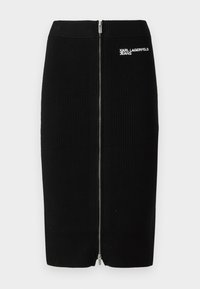 Juoda raštuota pieštuko sijonas vidutinio ilgio, su priekyje esančia užtrauktuku ir "KARL LAGERFELD JEANS" logotipu šone.