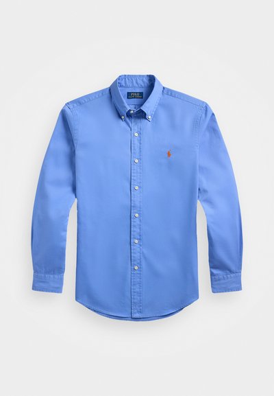 Light blue long-sleeve shirt made of cotton, featuring a button-down collar, front buttons, and a small red embroidered logo on the chest.