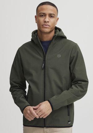 Dark green jacket with a hood, made from smooth material. Features a front zipper and a circular logo on the chest, with black trim accents.
