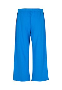 Modré kalhoty s širokými nohavicemi a elastickým pasem, vyrobené z hladké tkaniny. Mají jednoduchý design bez viditelných vzorů nebo akcentů.
