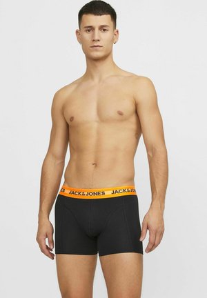 Zwarte boxershorts met een oranje elastische tailleband met de tekst "JACK & JONES." Soepele textuur en aansluitend ontwerp.