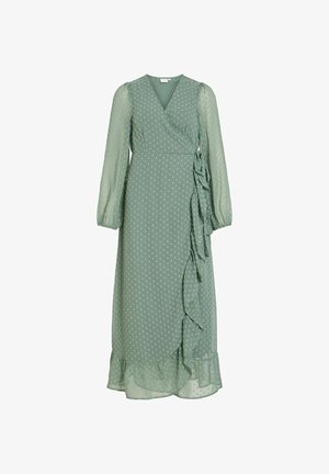 Zelené midi zavinovací šaty s dlouhými rukávy, jemným puntíkovým vzorem, volánkovým lemem vpředu i na spodním okraji a elastickými manžetami.