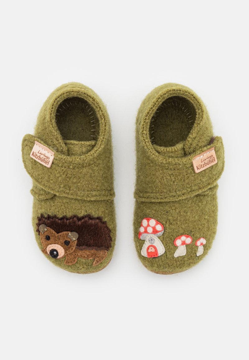 Green felt slippers with a stitched hedgehog and mushroom designs. Features a Velcro strap and a tag with the brand name "Living Kitzbühel."