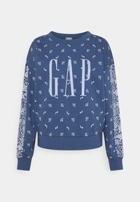 Donkerblauwe sweatshirt met wit "GAP"-logo, bloemenpatronen op de mouwen, geribbelde manchetten en zoom, ronde hals, gemaakt van zachte stof.