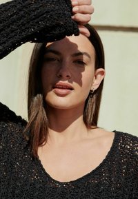 Next Stickad tröja - black