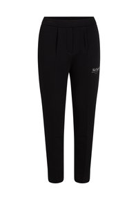 Black tapered pants with front pleats and small white logo text on upper thigh, designed for a slim fit.
