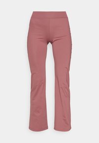 Pantalons roses ajustés en matériau extensible. Présentent une taille haute et un ourlet évasé. Texture lisse sans motifs ni accents.