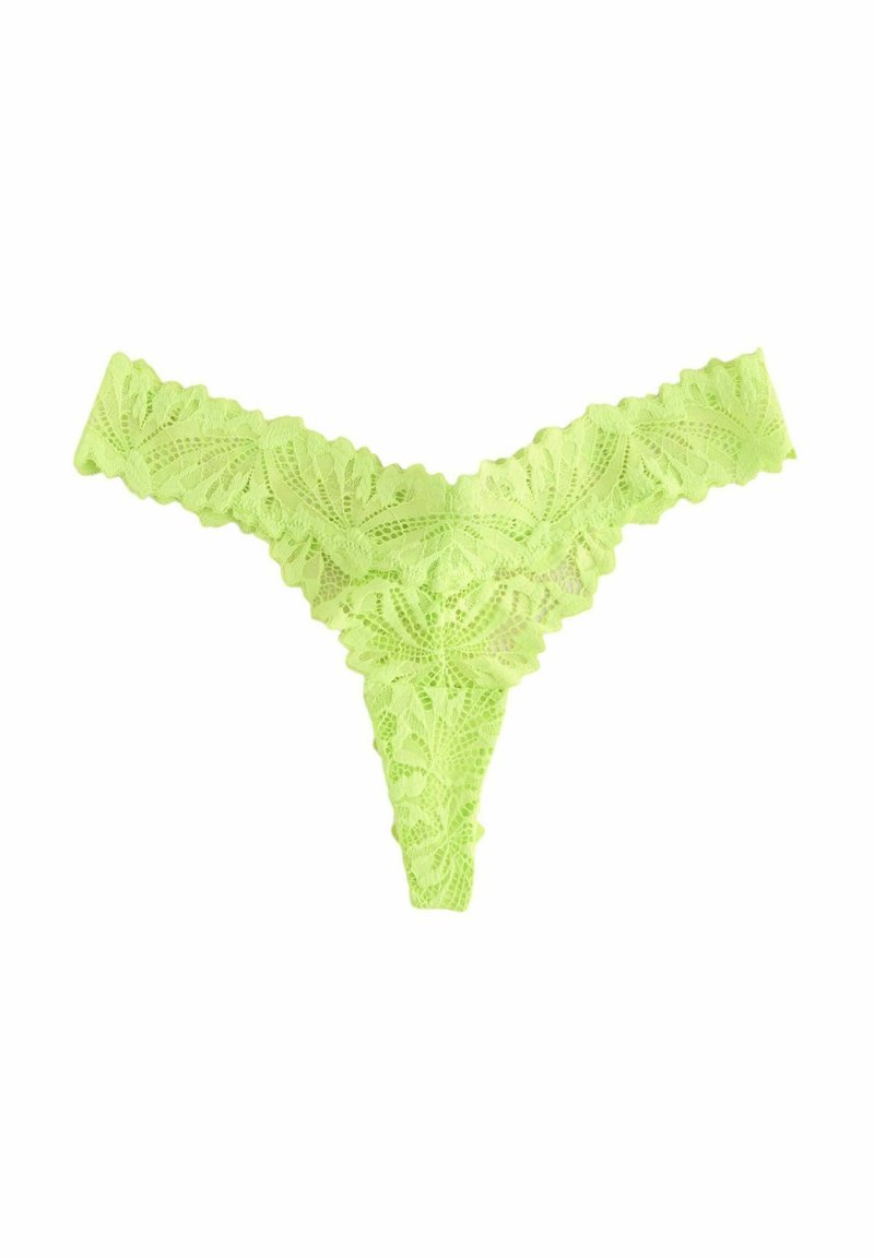 String en dentelle de couleur vert lime vif, avec un motif floral et des bords festonnés. Tissu extensible, conçu pour une couverture minimale.