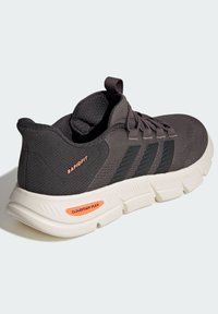 Sport sneaker in dark gray mesh with black accents. Features "Rapidfit" and "Cloudfoam Flex" branding. Lightweight textured rubber sole.