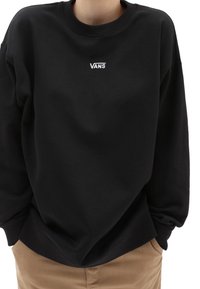 Sudadera negra hecha de una mezcla de algodón. Presenta un cuello redondo, puños y dobladillo acanalados, con un pequeño logo blanco de Vans en el pecho.