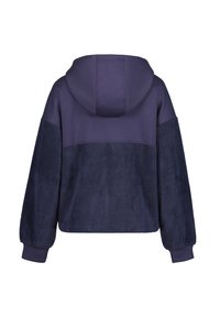 Tume sinine kapuutsiga sweatshirt, mille allosas on karvane tekstuur ja ülaservas sile kangas. Omab kapuutsi ja puffkätte.