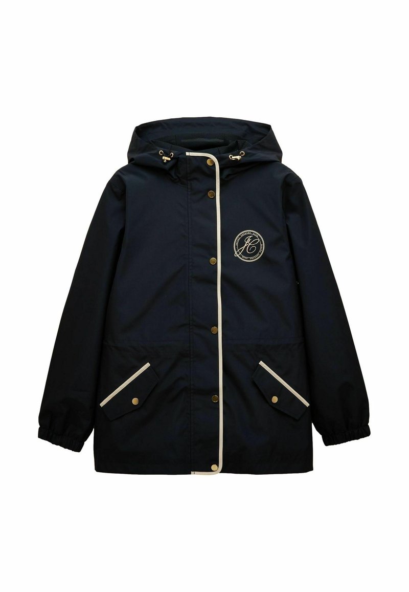 Jūras spēku ūdensnecaurlaidīga jaka ar kapuci, zelta detaļām, baltu apdari un divām priekšējām kabatām ar pogu aizdari. Izšūts logo uz krūtīm.